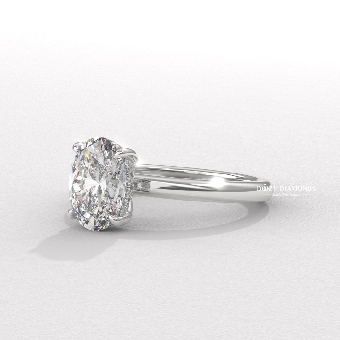 Oval hidden halo lab grown diamond ring fitted on finger