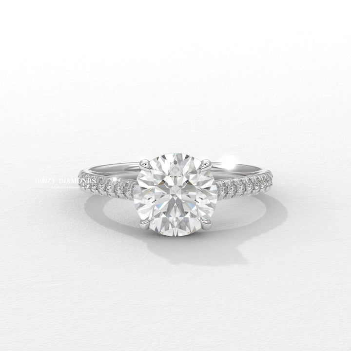 Round pave diamond ring presented in signature gift packaging
