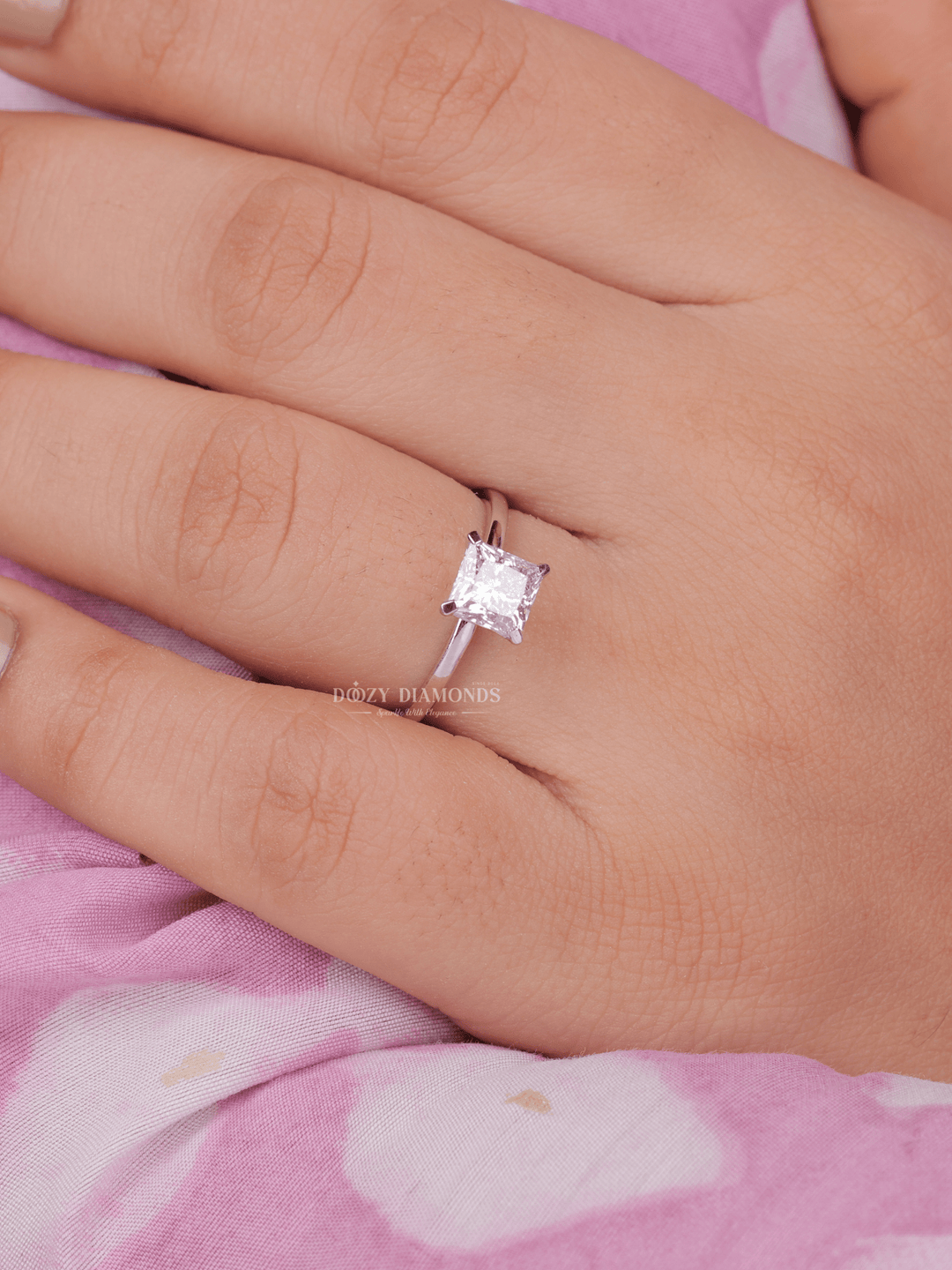 Macro shot of princess cut diamond facets in solitaire ring setting