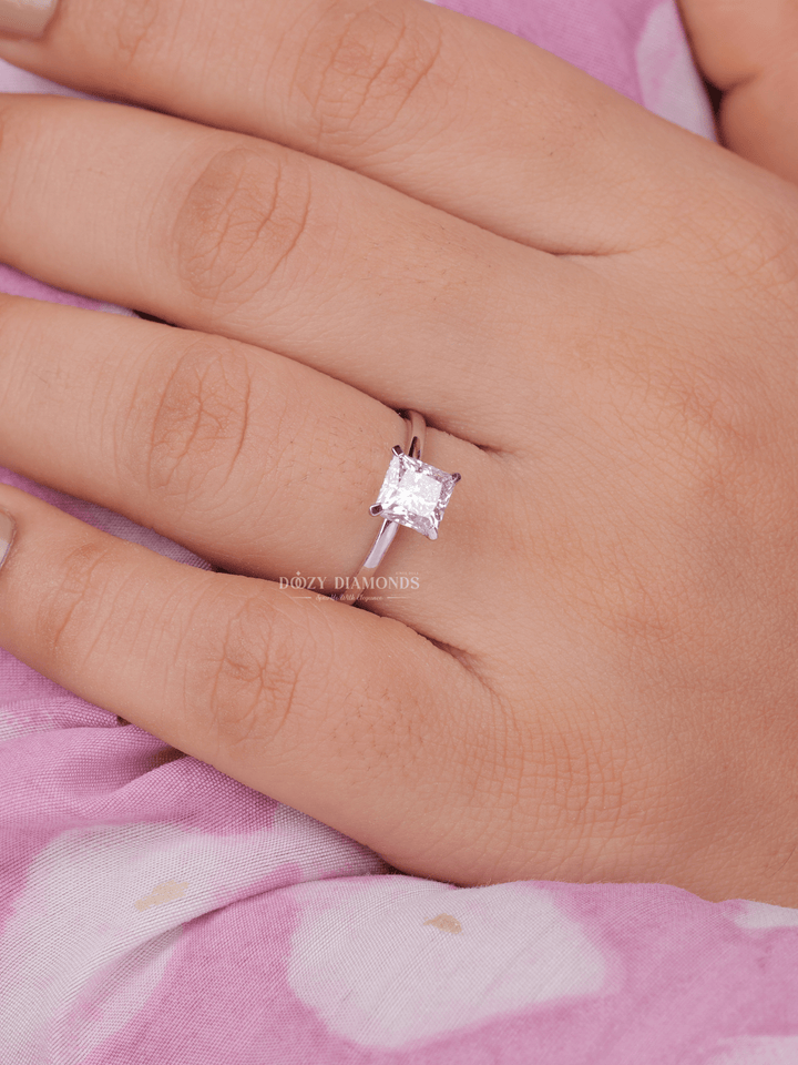 Macro shot of princess cut diamond facets in solitaire ring setting