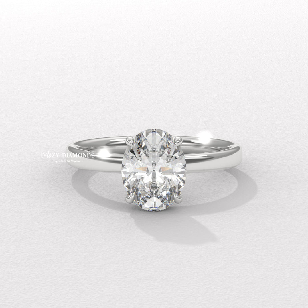 Oval solitaire engagement ring viewed from the side