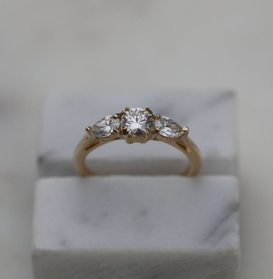Profile view of round cut solitaire engagement ring band