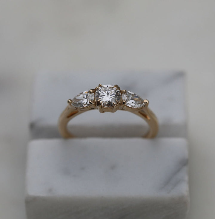 Profile view of round cut solitaire engagement ring band