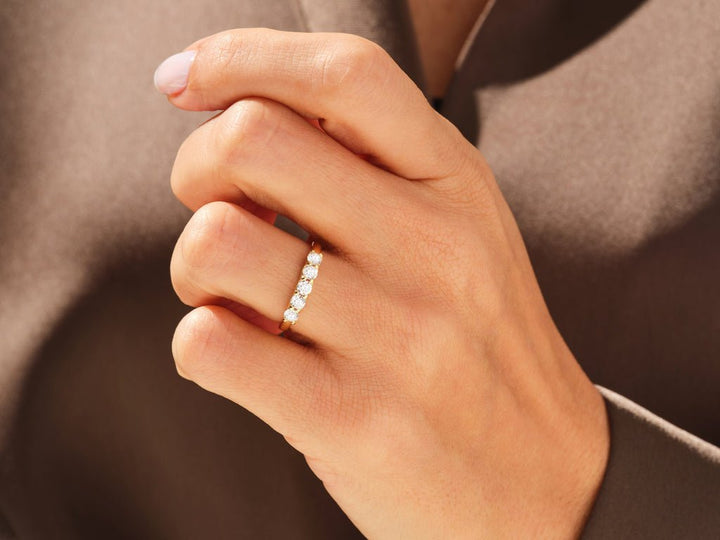 Round diamond wedding band in rose gold