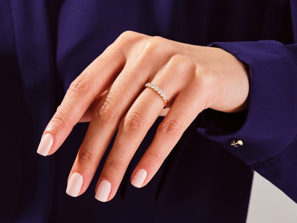 Round diamond band stacked with engagement ring