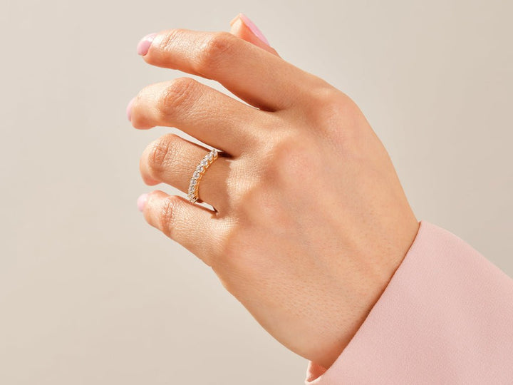 Round diamond wedding band in rose gold