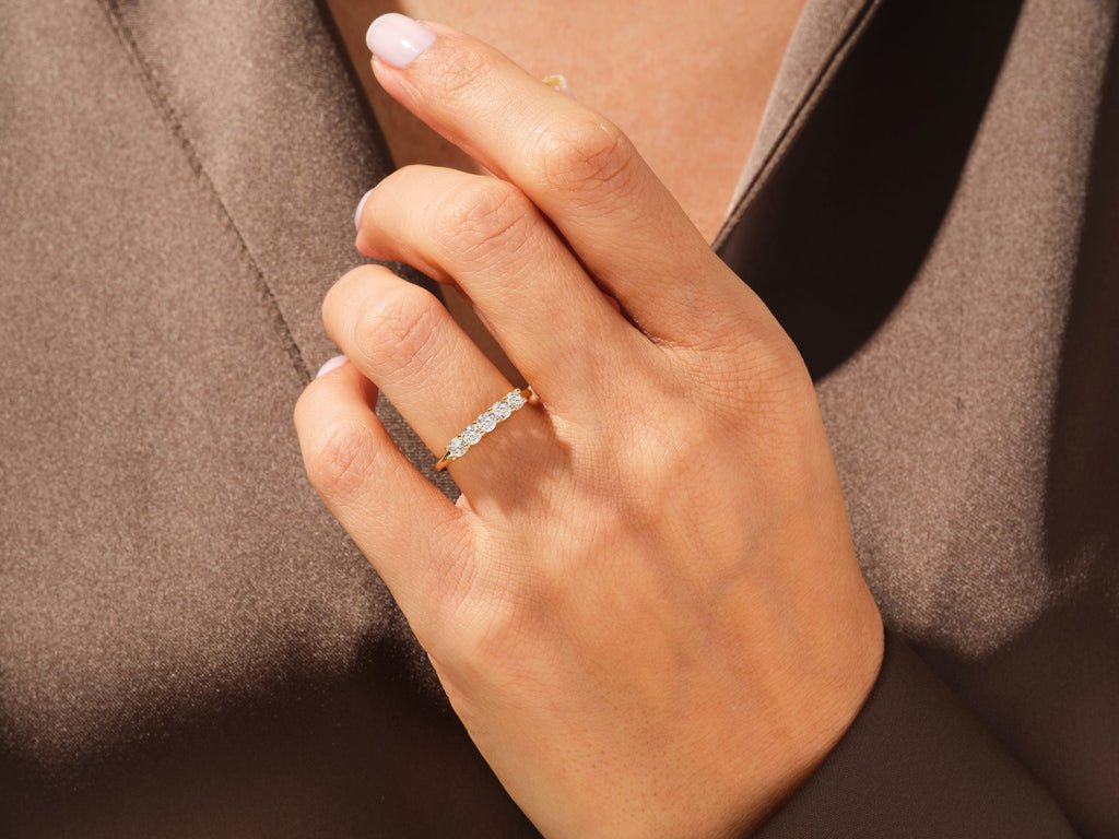 Round diamond band stacked with engagement ring