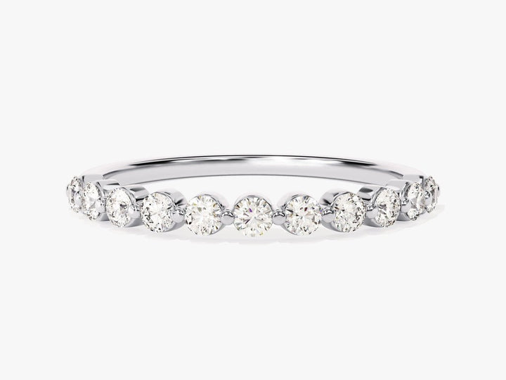 Round diamond band stacked with engagement ring