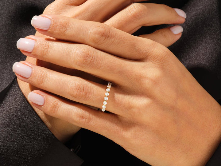 Side view of round diamond wedding band