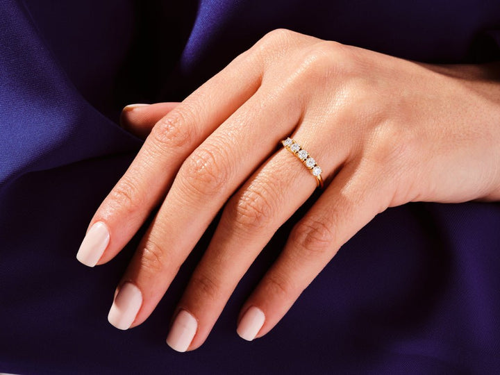 Round diamond wedding band in rose gold
