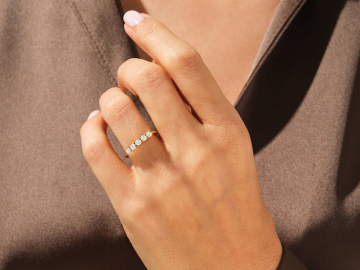 Round lab grown diamond band worn on hand