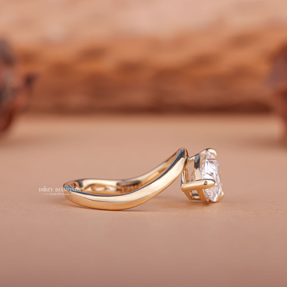 Pear east west engagement ring photographed in natural light