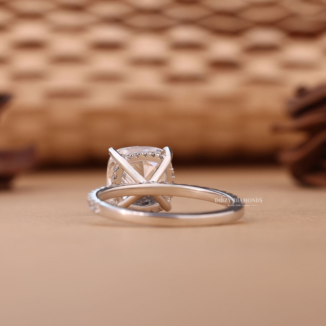 Profile view of cushion cut hidden halo engagement ring band