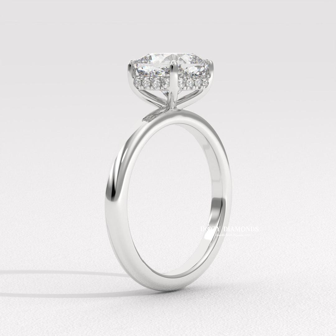 Certified cushion cut diamond featured in hidden halo engagement ring