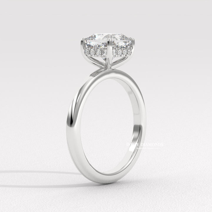 Certified cushion cut diamond featured in hidden halo engagement ring