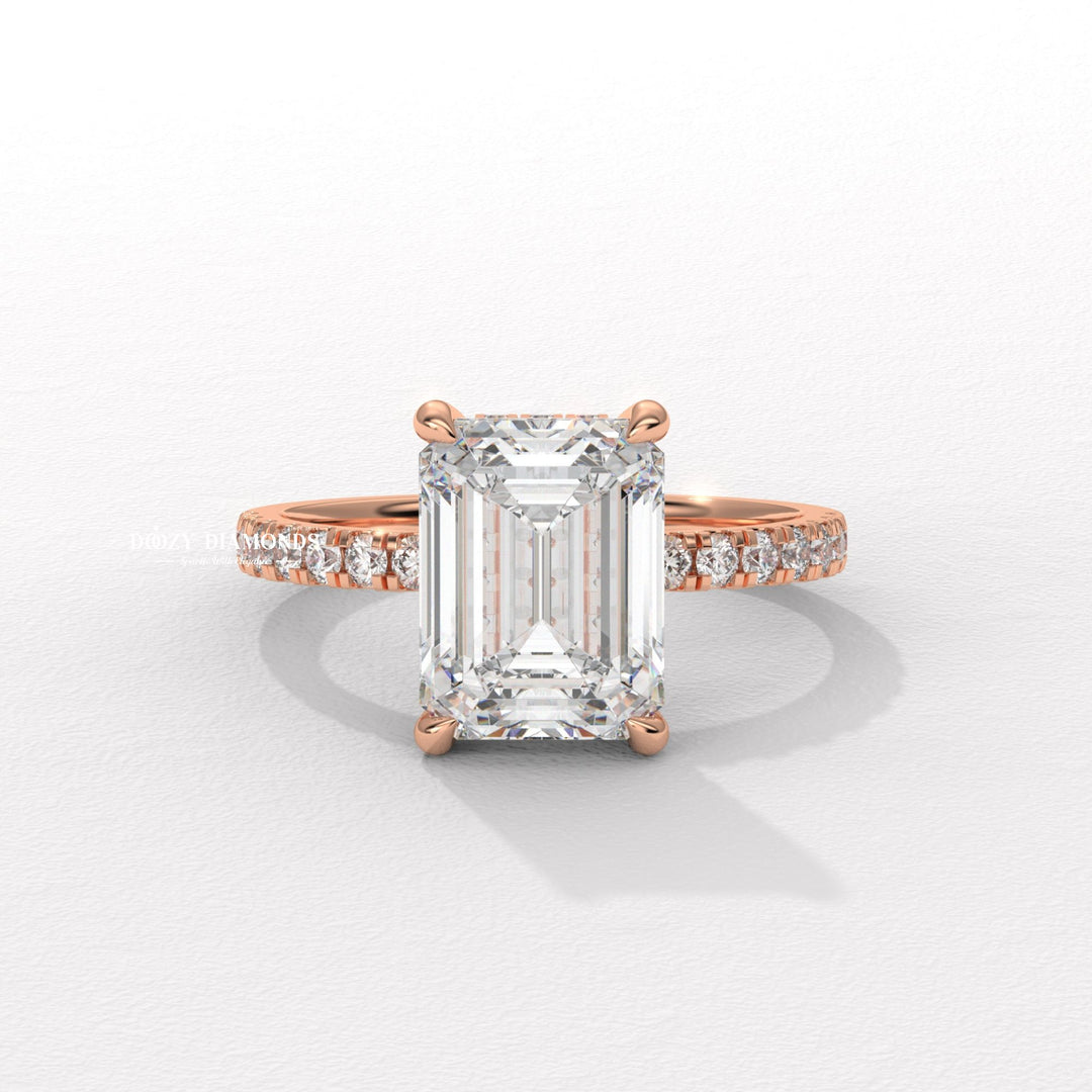 Emerald hidden halo engagement ring viewed from the side