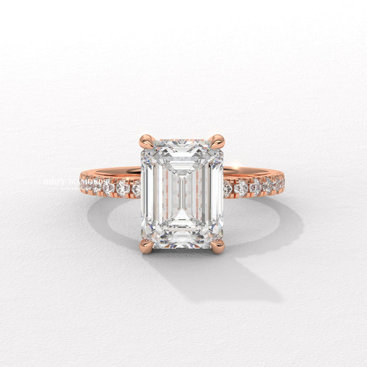 Emerald hidden halo engagement ring viewed from the side