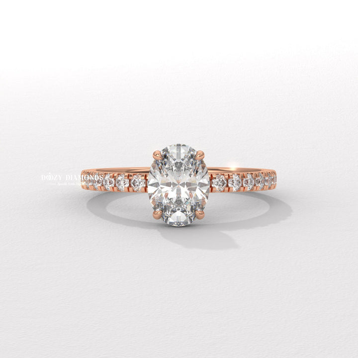 Angled view of oval cut diamond in hidden halo setting