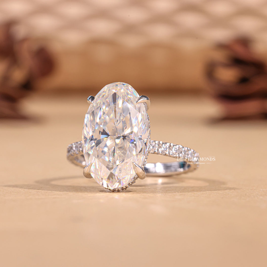 Oval hidden halo engagement ring finished in polished solid gold