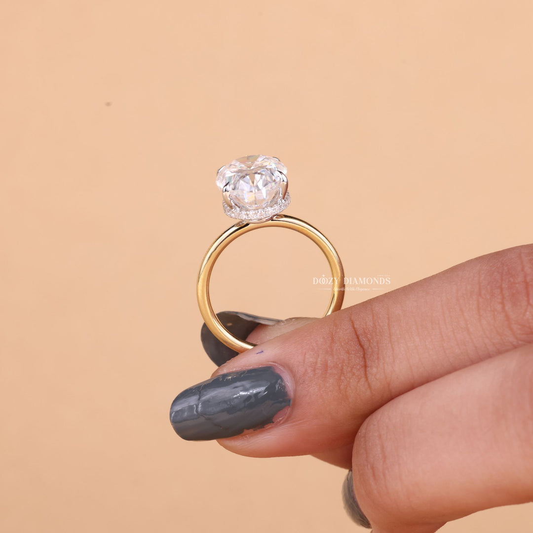 Macro shot of oval cut diamond facets in hidden halo ring setting