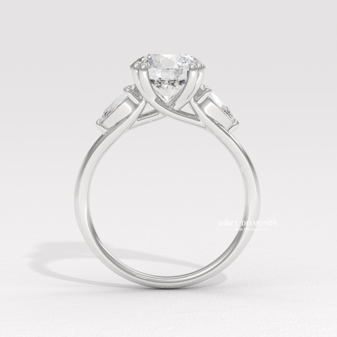 Round three stone engagement ring viewed from the side