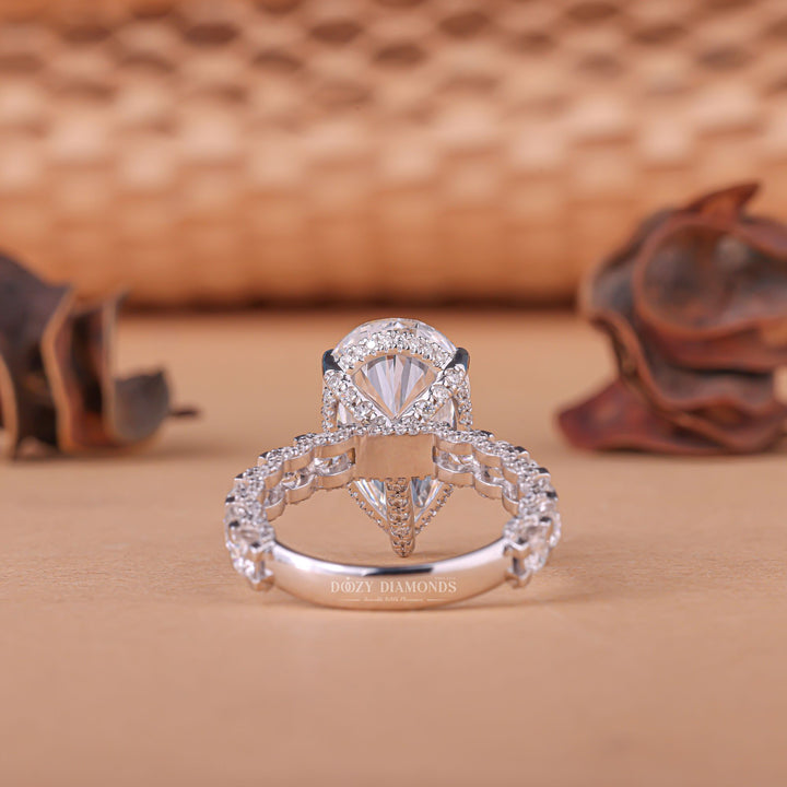 Pear hidden halo engagement ring viewed from the side
