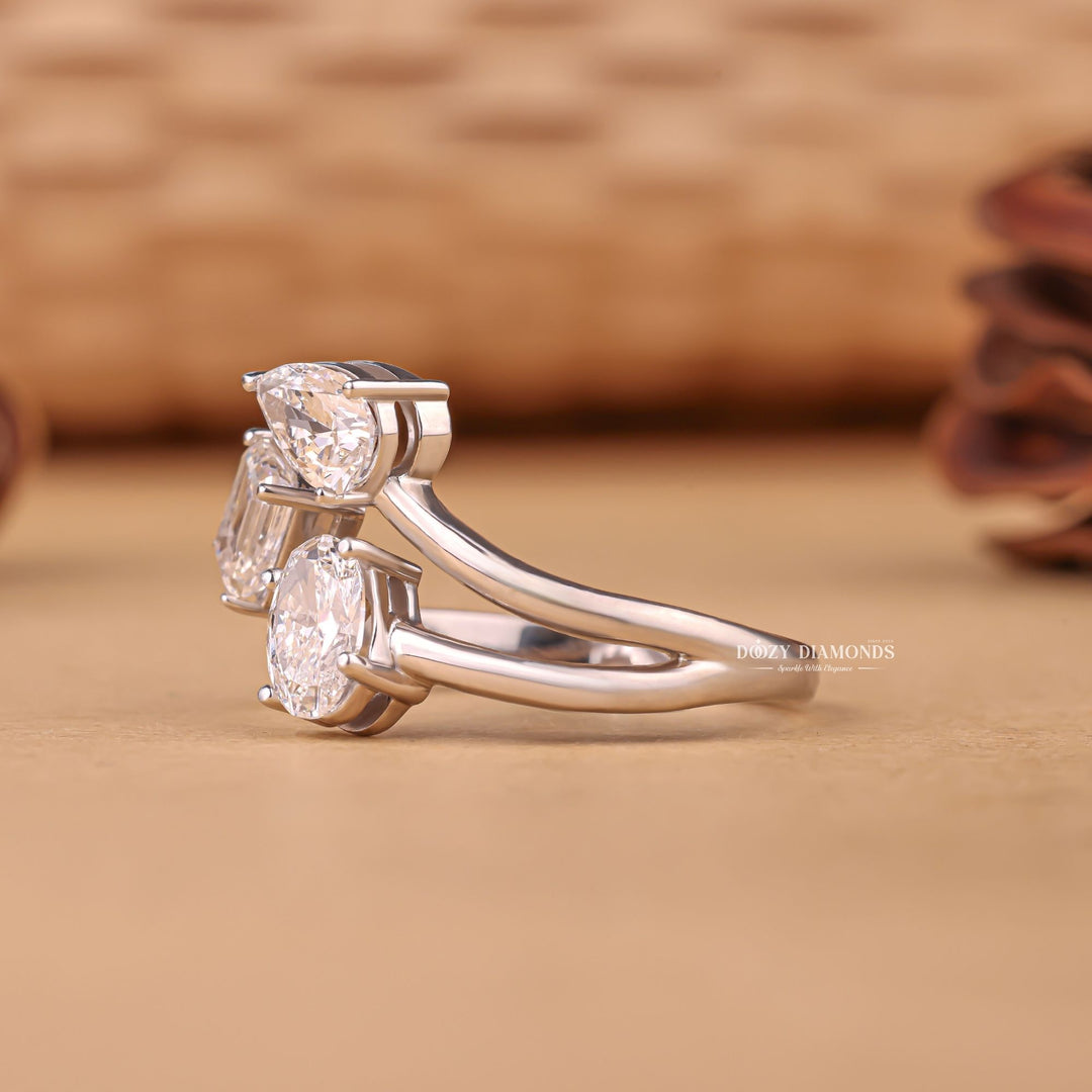 Oval three stone engagement ring finished in polished solid gold