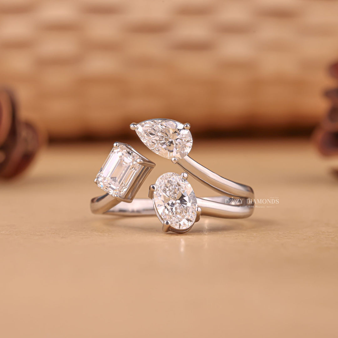 Oval three stone engagement ring photographed in natural light