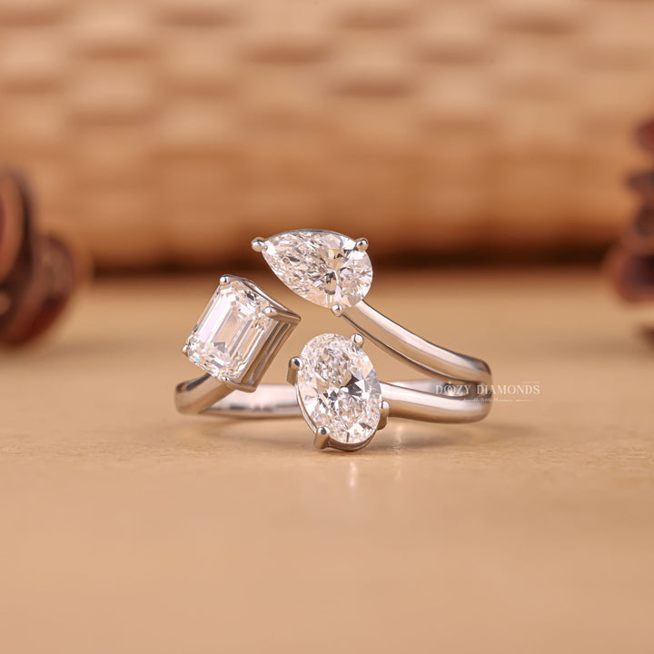 Oval three stone engagement ring photographed in natural light