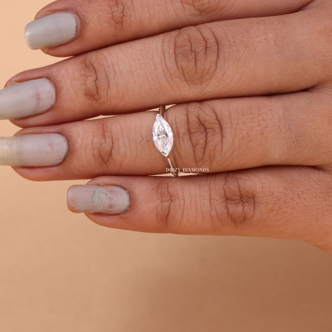 Macro shot of marquise cut diamond facets in east west ring setting