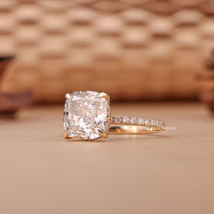 Certified cushion cut diamond featured in hidden halo engagement ring