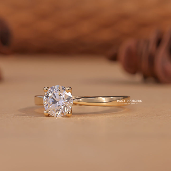 Detailed close-up of round solitaire diamond engagement ring
