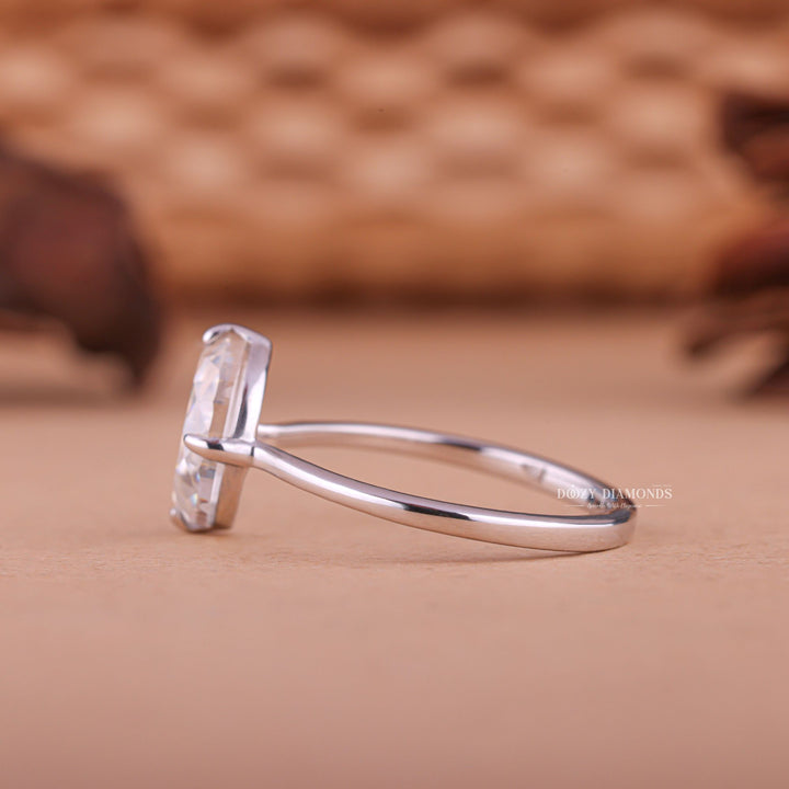 Unboxing view of half moon cut art deco diamond engagement ring