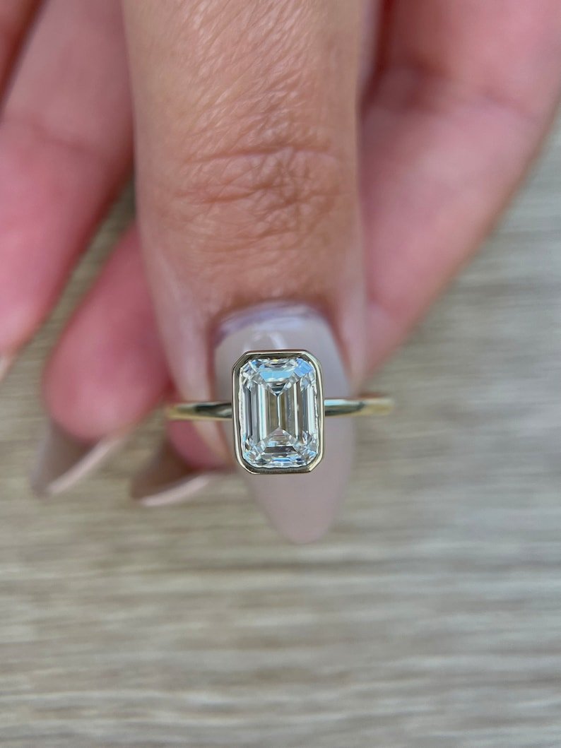 Top-down view of emerald cut bezel engagement ring