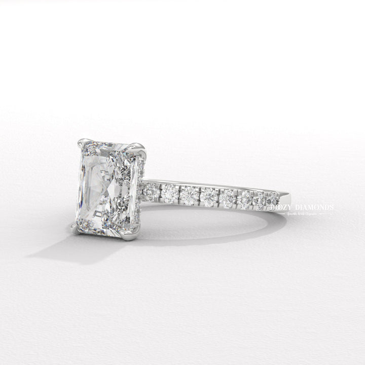 Close-up of radiant cut center diamond in hidden halo engagement ring
