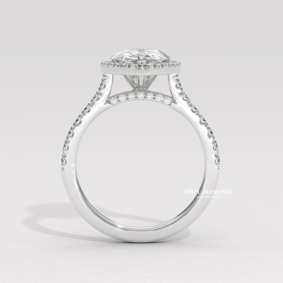 Profile view of pear cut halo engagement ring band
