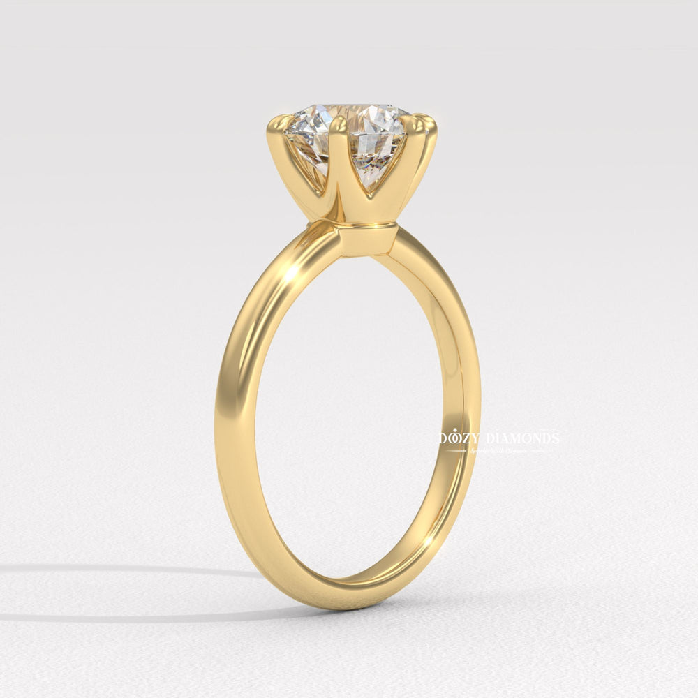 Close-up of round cut center diamond in solitaire engagement ring