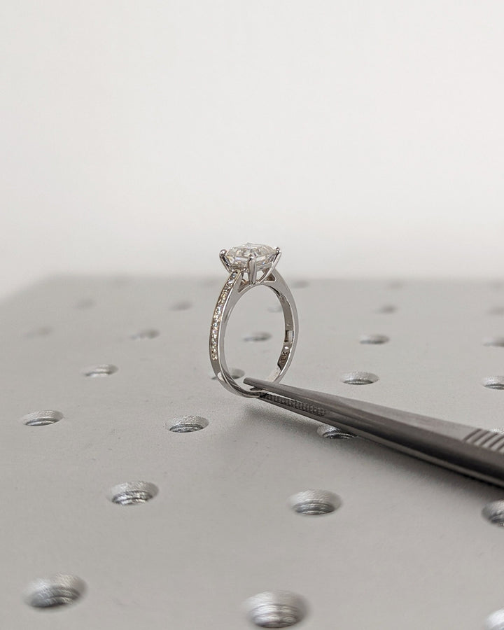 Detailed close-up of asscher solitaire diamond engagement ring