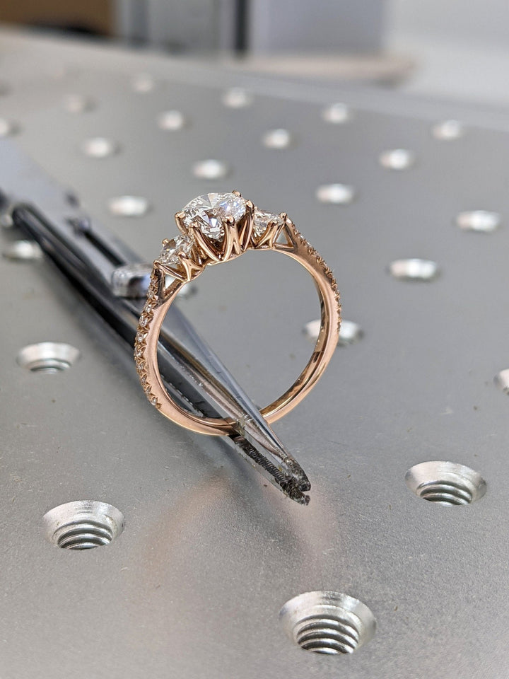 Round solitaire engagement ring viewed from the side
