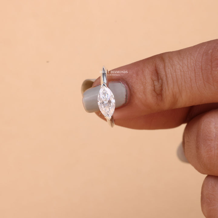 Side angle of marquise east west diamond engagement ring