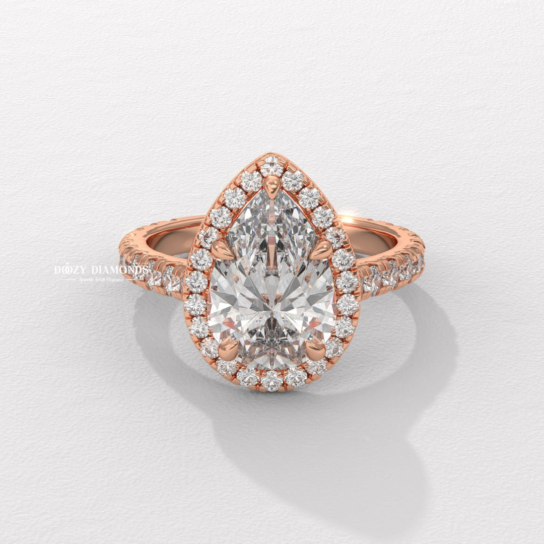 Pear halo ring set with an IGI graded diamond