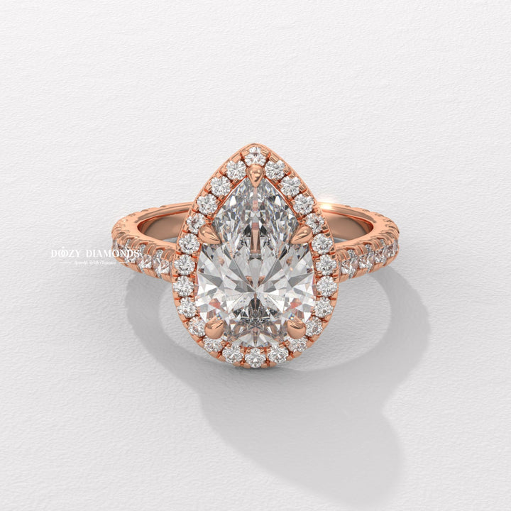 Pear halo ring set with an IGI graded diamond