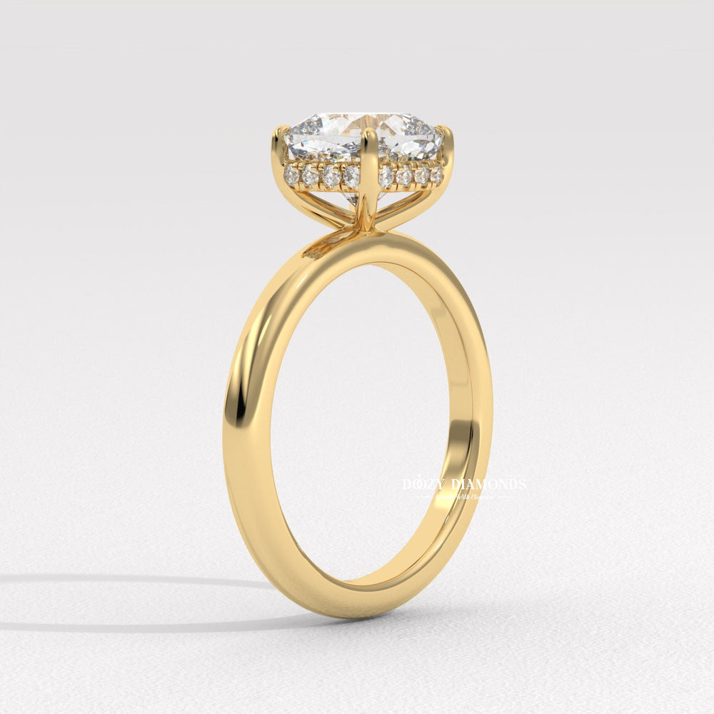 Cushion hidden halo engagement ring shown on hand for true-to-life sizing