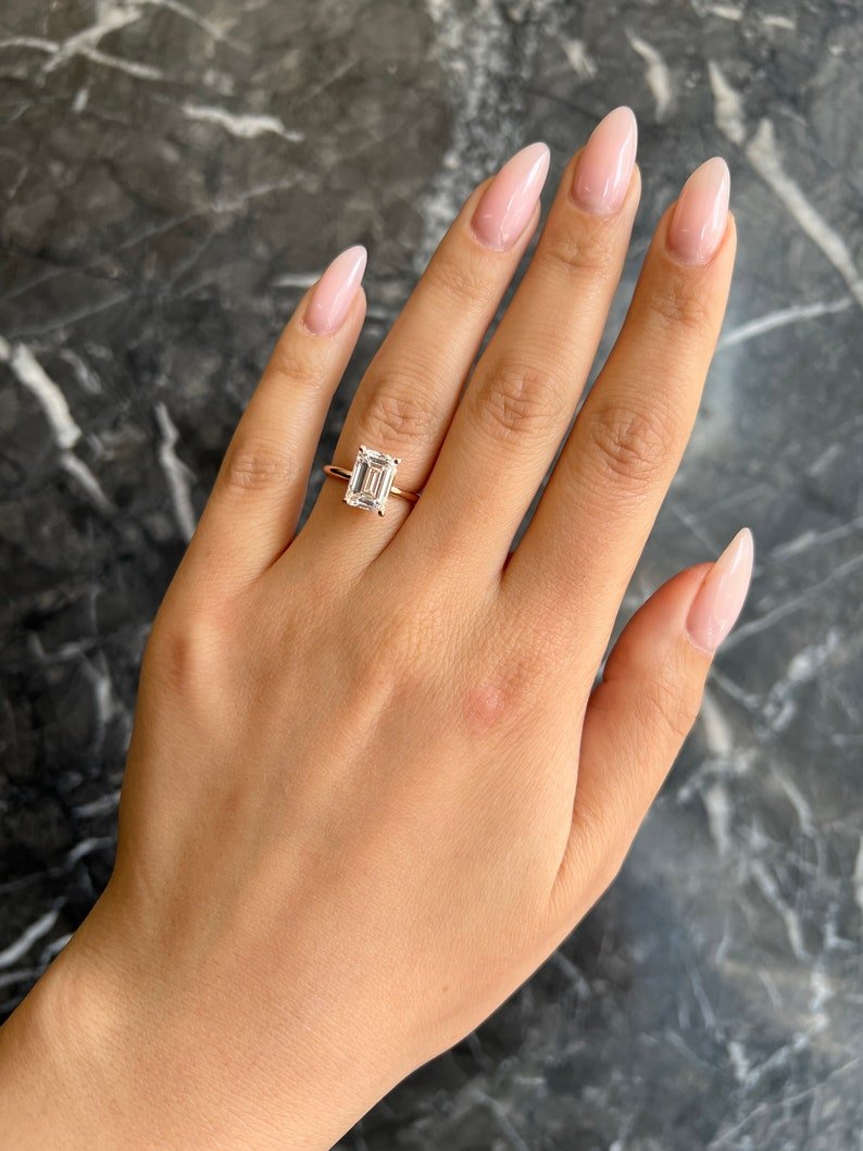 Top-down view of emerald cut solitaire engagement ring