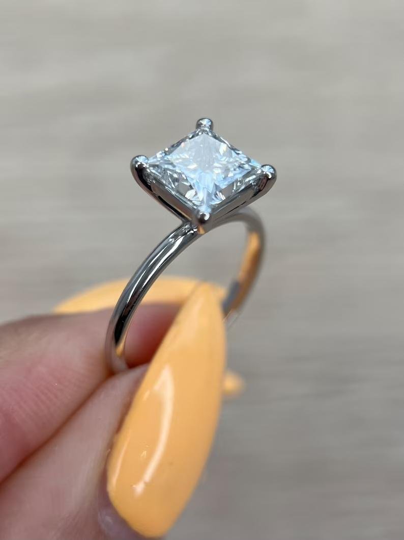 Fine craftsmanship detail on princess solitaire engagement ring