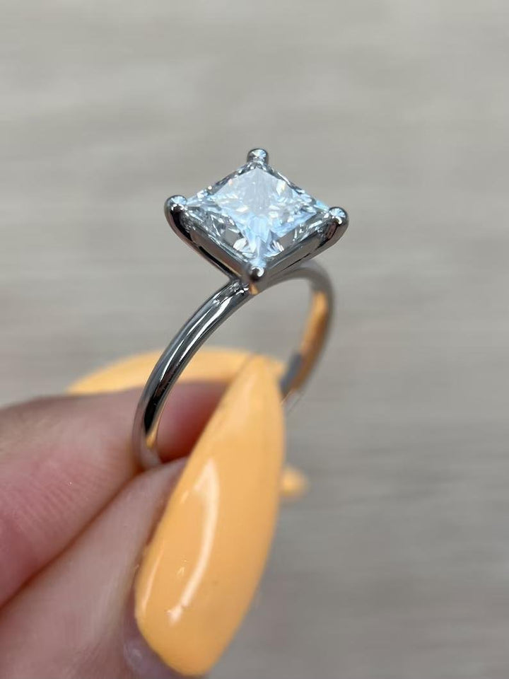 Fine craftsmanship detail on princess solitaire engagement ring