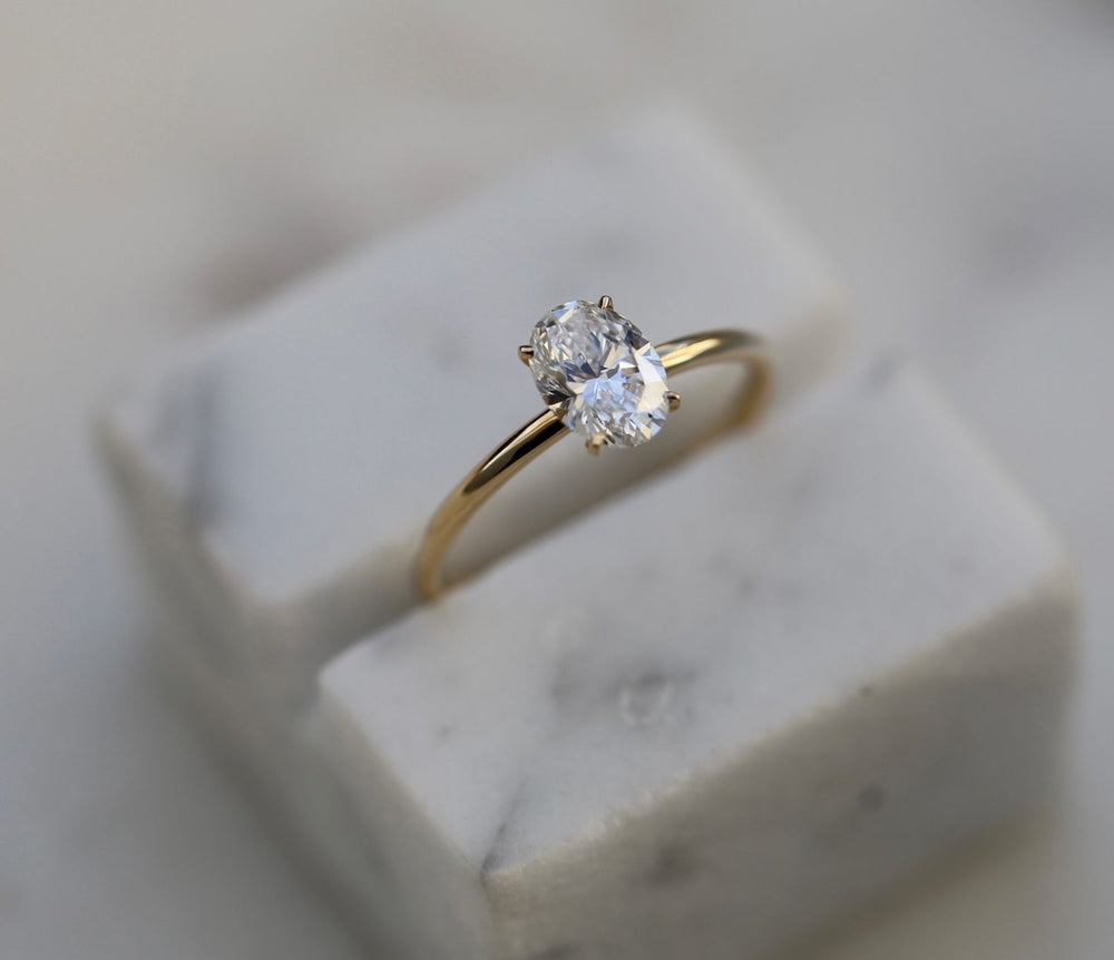 Oval solitaire engagement ring with brilliant diamond sparkle