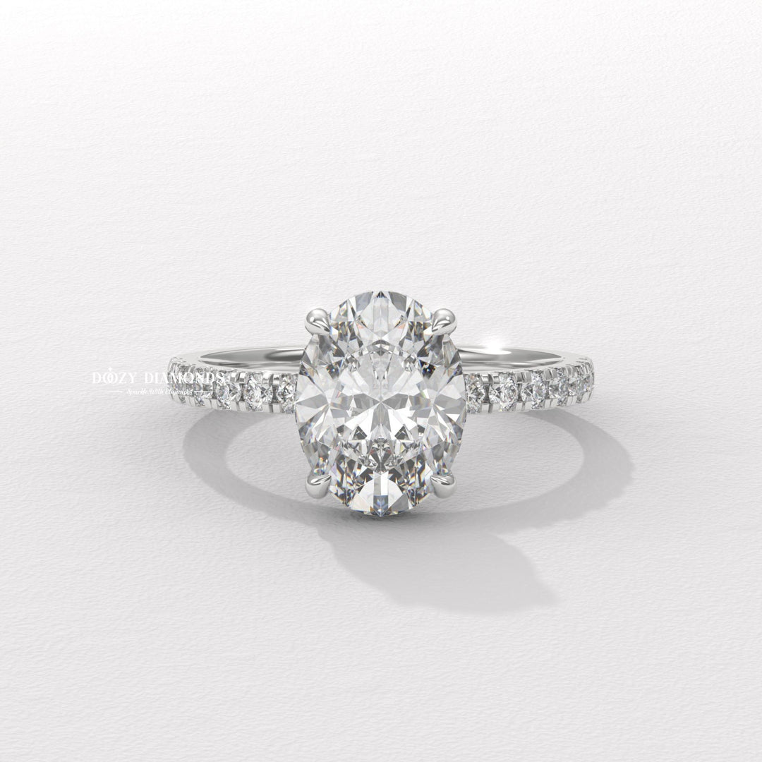 Close-up of oval cut center diamond in hidden halo engagement ring