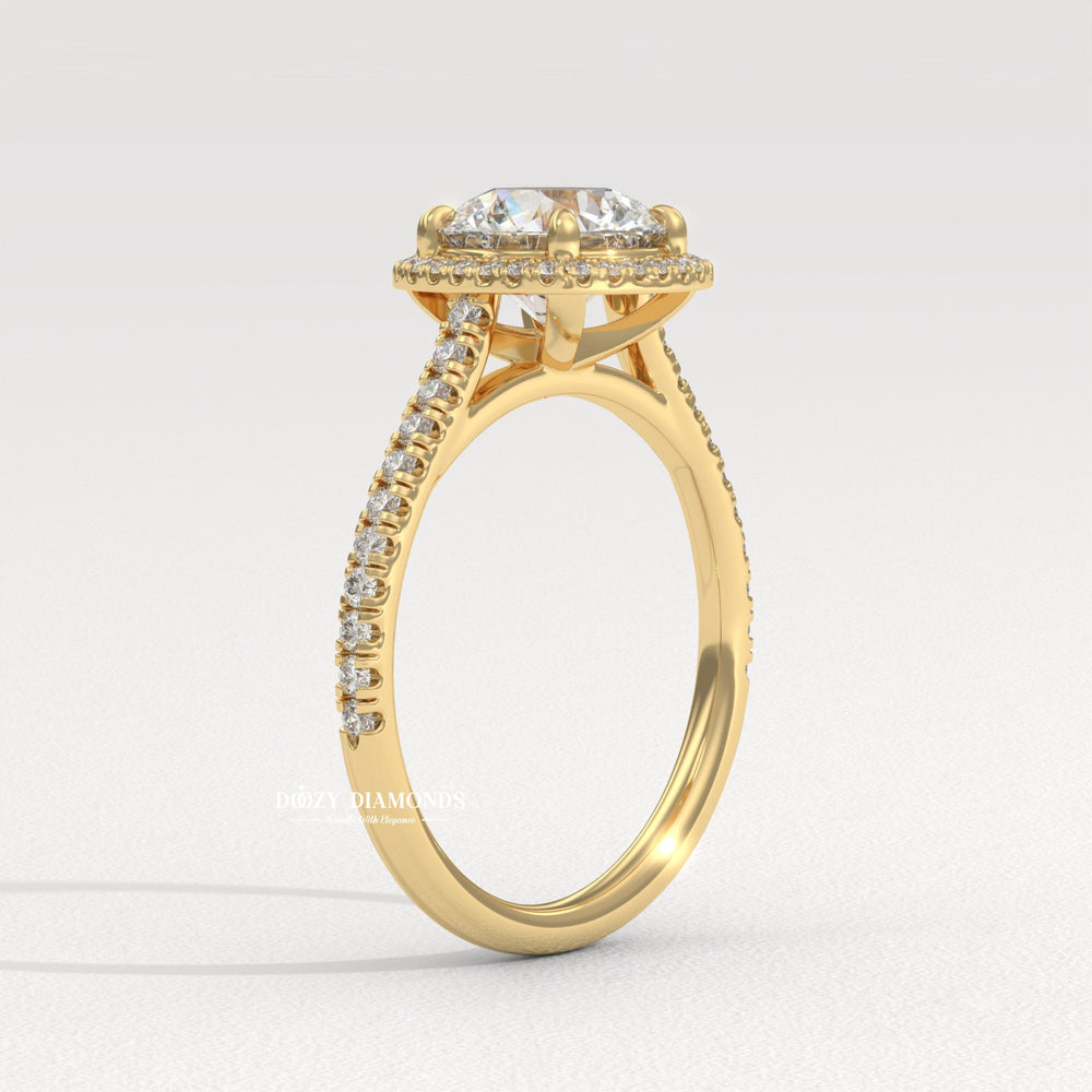 Close-up of round cut center diamond in halo engagement ring