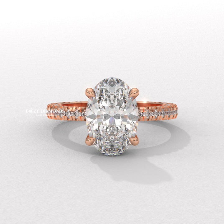 Oval pave engagement ring viewed from the side